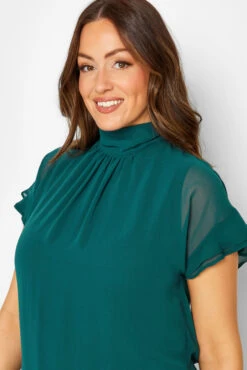 M&Co Green High Neck Frill Sleeve Blouse 10 M&Co Green High Neck Frill Sleeve Blouse -M&Co Sales Store 5a260f22 6ca8 46 550341 D scaled